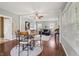 Spacious open-concept living area, connecting the dining and living spaces with natural light from windows at 1720 Woodlawn Ave, Indianapolis, IN 46203
