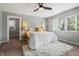 Comfortable bedroom with carpet, neutral walls, natural light, and a ceiling fan at 1720 Woodlawn Ave, Indianapolis, IN 46203