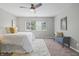 Comfortable bedroom featuring soft carpet, neutral walls, great lighting, and a ceiling fan at 1720 Woodlawn Ave, Indianapolis, IN 46203