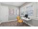 A bright, naturally lit office featuring soft carpet, light walls and a modern desk at 1720 Woodlawn Ave, Indianapolis, IN 46203