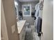 Well-lit bathroom with a double sink vanity, a window, and modern fixtures at 1733 E 47Th St, Anderson, IN 46013