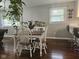 Light-filled dining area featuring a table with seating for four and hardwood floors at 1733 E 47Th St, Anderson, IN 46013