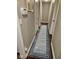 Long hallway featuring hardwood floors, a patterned runner, and access to multiple rooms at 1733 E 47Th St, Anderson, IN 46013