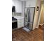 Kitchen featuring stainless steel refrigerator, gas range, white cabinetry, and quartz counters at 1733 E 47Th St, Anderson, IN 46013
