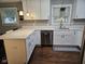 Contemporary kitchen with white cabinets, stainless steel dishwasher and faucet, and quartz countertops at 1733 E 47Th St, Anderson, IN 46013
