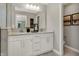 Bright bathroom with double sinks, white cabinetry, and modern fixtures at 17717 Remy Rd, Noblesville, IN 46062