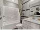 Clean, modern bathroom featuring a tub/shower combo, white vanity, and decorative artwork at 17717 Remy Rd, Noblesville, IN 46062