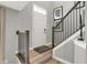 Inviting entryway with light hardwood floors and stylish staircase at 17717 Remy Rd, Noblesville, IN 46062
