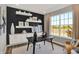 Bright home office with shelves, a large window, and an exterior view at 17717 Remy Rd, Noblesville, IN 46062