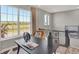 Sun-filled office space with large windows overlooking neighborhood and neutral contemporary decor at 17717 Remy Rd, Noblesville, IN 46062