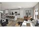 Open-concept kitchen and dining area with modern appliances and breakfast bar at 17717 Remy Rd, Noblesville, IN 46062