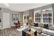 Open-concept living and dining area with large windows and stylish furniture at 17717 Remy Rd, Noblesville, IN 46062