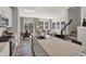 Open concept living space showing kitchen, dining area, living room, and stairwell at 17717 Remy Rd, Noblesville, IN 46062