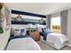 Charming bedroom design with nautical-themed decor, twin beds, and a decorative accent wall at 17721 Remy Rd, Noblesville, IN 46062