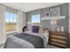 Cozy bedroom featuring soft gray walls, large windows, stylish decor, and comfortable furnishings at 17721 Remy Rd, Noblesville, IN 46062