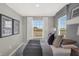 Inviting bedroom with natural light, featuring modern décor and calming gray tones at 17721 Remy Rd, Noblesville, IN 46062
