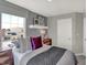 Stylish bedroom showcasing contemporary decor, a comfortable bed, and plenty of natural light at 17721 Remy Rd, Noblesville, IN 46062