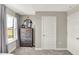 Neutral bedroom with decorative dresser, complementary mirror, and natural light from the nearby window at 17721 Remy Rd, Noblesville, IN 46062