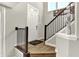 Bright foyer with tile flooring, white door, staircase and neutral walls, creating a welcoming entrance at 17721 Remy Rd, Noblesville, IN 46062