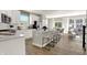 Bright and airy kitchen with modern appliances, white cabinets, and an island with barstool seating, perfect for gathering at 17721 Remy Rd, Noblesville, IN 46062