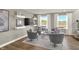 Inviting seating area with decor, windows, and neutral wall paint provides the perfect place for entertaining and relaxation at 17721 Remy Rd, Noblesville, IN 46062