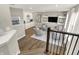 This modern living room showcases a bar, seating, and recessed lighting, perfect for entertaining at 17721 Remy Rd, Noblesville, IN 46062