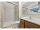 Bathroom with a shower and vanity with a window view at 1826 Shorter Dr, Indianapolis, IN 46214