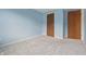 Bedroom with blue walls and neutral carpeting at 1826 Shorter Dr, Indianapolis, IN 46214