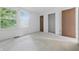 Bright bedroom with two windows and neutral carpet flooring at 1826 Shorter Dr, Indianapolis, IN 46214