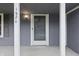 Close-up of the front door and porch of the gray home, showing the house number at 1826 Shorter Dr, Indianapolis, IN 46214