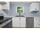 New kitchen featuring white cabinets, stainless appliances and gray walls at 1826 Shorter Dr, Indianapolis, IN 46214