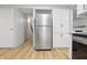 Open concept kitchen with stainless steel appliances and white cabinetry at 1826 Shorter Dr, Indianapolis, IN 46214