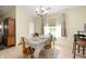 Cozy dining area with seating for four, a chandelier, and a window providing natural light and views at 18913 Course View Rd, Noblesville, IN 46060