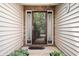 Inviting front entrance with a decorative glass door and sidelights, framed by brick and lush greenery at 18913 Course View Rd, Noblesville, IN 46060