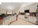 Well-equipped kitchen with white cabinets, neutral countertops, and essential appliances for culinary endeavors at 18913 Course View Rd, Noblesville, IN 46060
