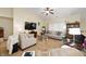 Spacious living room boasting a vaulted ceiling, carpet flooring, and a large television for entertainment at 18913 Course View Rd, Noblesville, IN 46060