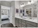 Bathroom featuring double sinks, gray cabinetry, and a view to the main bedroom at 19390 Mcbee Ave, Westfield, IN 46074