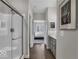 Modern bathroom featuring a glass-enclosed shower and access to the main bedroom at 19390 Mcbee Ave, Westfield, IN 46074