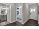 Bright hallway with a view into bedroom and bathroom, featuring modern neutral paint at 19390 Mcbee Ave, Westfield, IN 46074
