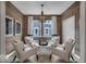 Cozy seating area featuring wood paneling, natural light, and neutral decor at 19390 Mcbee Ave, Westfield, IN 46074