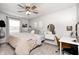 Comfortable bedroom featuring a ceiling fan, a window, and a neutral color scheme at 203 Leerkamp Dr, Franklin, IN 46131