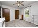 Bright bedroom with a window, ample storage, neutral tones, and a modern ceiling fan at 203 Leerkamp Dr, Franklin, IN 46131