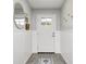 Bright entryway featuring decorative wainscoting, wood-look floors and stylish accents at 203 Leerkamp Dr, Franklin, IN 46131