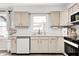 Kitchen featuring quartz countertops, sleek cabinetry, and modern appliances at 203 Leerkamp Dr, Franklin, IN 46131