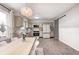 Stylish kitchen with stainless steel appliances, pendant lighting, and dining area at 203 Leerkamp Dr, Franklin, IN 46131
