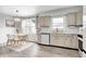 Bright eat-in kitchen featuring modern cabinets, stainless steel sink, and an adjacent dining area at 203 Leerkamp Dr, Franklin, IN 46131