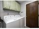 Well-equipped laundry room with modern appliances and ample storage space at 203 Leerkamp Dr, Franklin, IN 46131