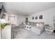 Spacious living room with plush seating, neutral tones, and ample natural light at 203 Leerkamp Dr, Franklin, IN 46131