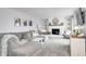 Cozy living room featuring a brick fireplace, plush seating, and neutral tones at 203 Leerkamp Dr, Franklin, IN 46131