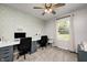 Bright home office space with a large desk, computer, and neutral decor at 203 Leerkamp Dr, Franklin, IN 46131